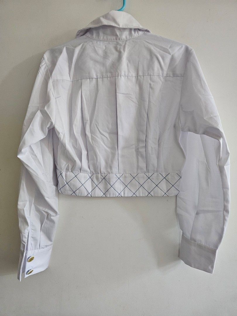 Chanel La Pausa Silk Cotton Crop Blouse Top (Category: Blouses) located in Singapore. Submitted by prelovedtoluvv (Listing ID 1437337595, Image 2). Description: - cutlabel Chanel cropped Top blouse - White color size36 - Quilted design on the front - Gold buttons with Chanel logo sopretty - Made in France NO Trades, Lowballers,Fussy NO Refund Return once sold .