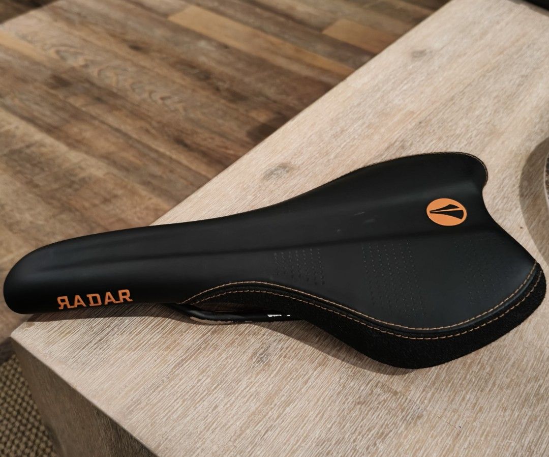 SDG Radar Bike Saddle - Orange (Category: Parts & Accessories) located in Singapore. Submitted by phi-428 (Listing ID 1437354956, Image 1). Description: - Features stylish orange stitching and logo detailing. - Designed for comfortable cycling. - Easy to install and ready to use. - Ideal for upgrading or replacing your current saddle..