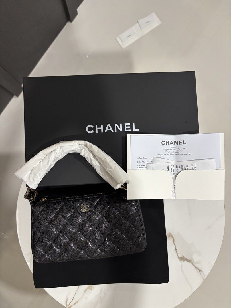 Chanel 26A clutch on chain in black carviar and LGHW model AP4704 (Category: Bags & Wallets) located in Singapore. Submitted by kelly63chong (Listing ID 1438006273, Image 6). Description: - Authentic Chanel chain wallet - Classic quilted caviar leather - Features a chain strap - Comes with original box, dust bag, and receipt - Perfect for everyday or special occasions - Purchased in Singapore.