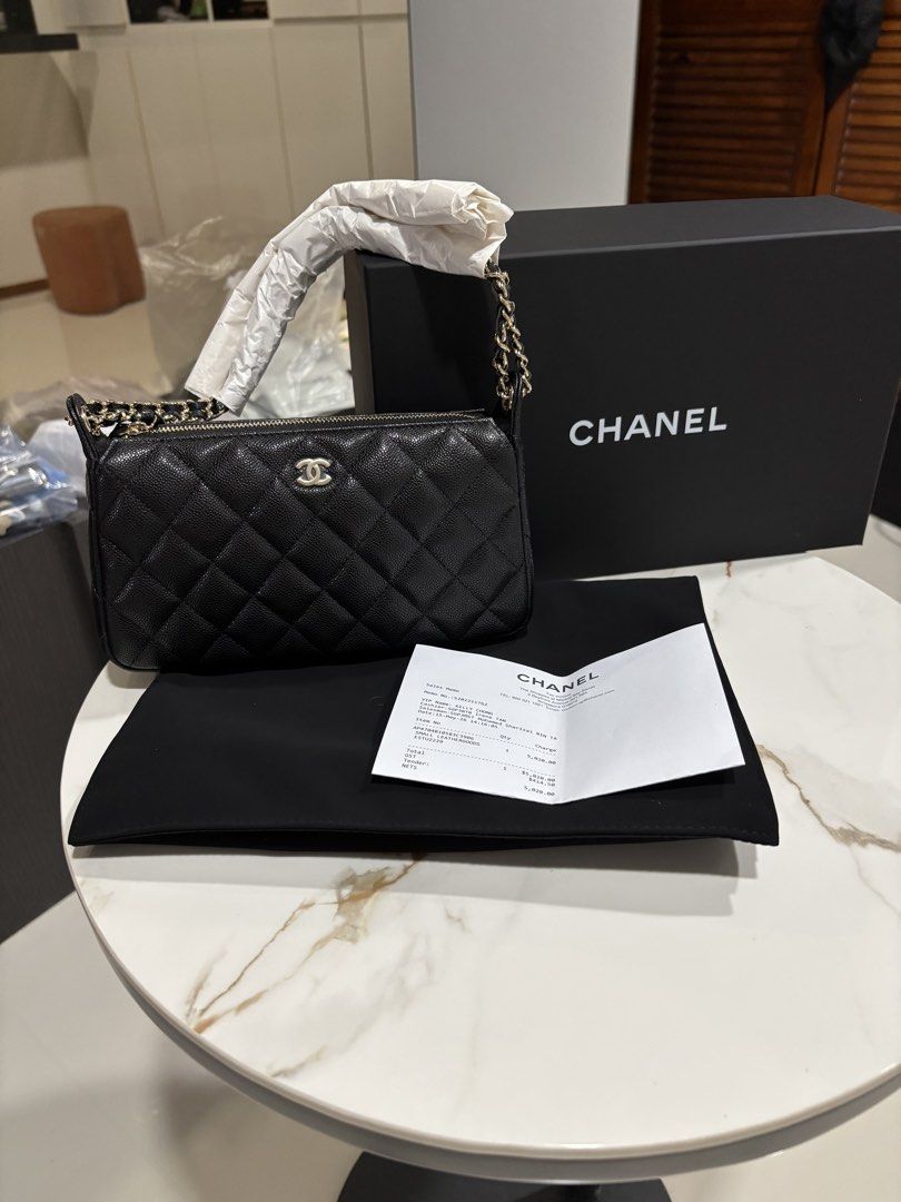 Chanel 26A clutch on chain in black carviar and LGHW model AP4704 (Category: Bags & Wallets) located in Singapore. Submitted by kelly63chong (Listing ID 1438006273, Image 2). Description: - Authentic Chanel chain wallet - Classic quilted caviar leather - Features a chain strap - Comes with original box, dust bag, and receipt - Perfect for everyday or special occasions - Purchased in Singapore.