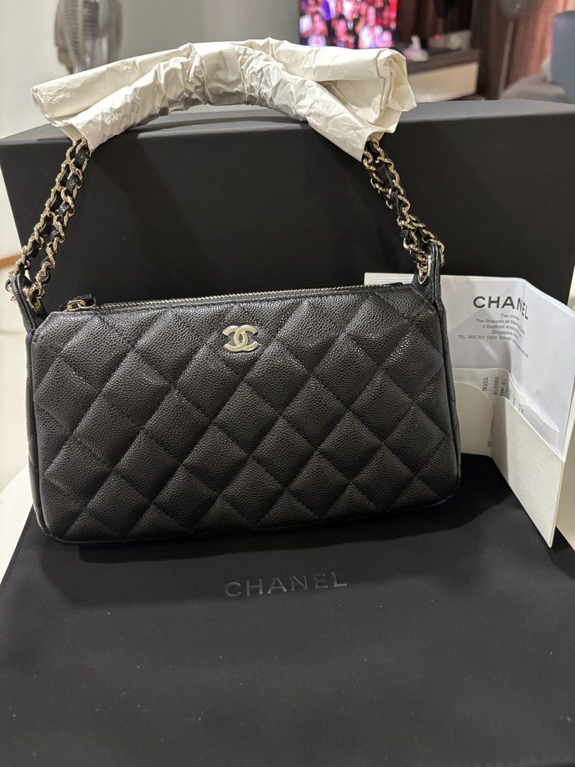 Chanel 26A clutch on chain in black carviar and LGHW model AP4704 (Category: Bags & Wallets) located in Singapore. Submitted by kelly63chong (Listing ID 1438006273, Image 1). Description: - Authentic Chanel chain wallet - Classic quilted caviar leather - Features a chain strap - Comes with original box, dust bag, and receipt - Perfect for everyday or special occasions - Purchased in Singapore.