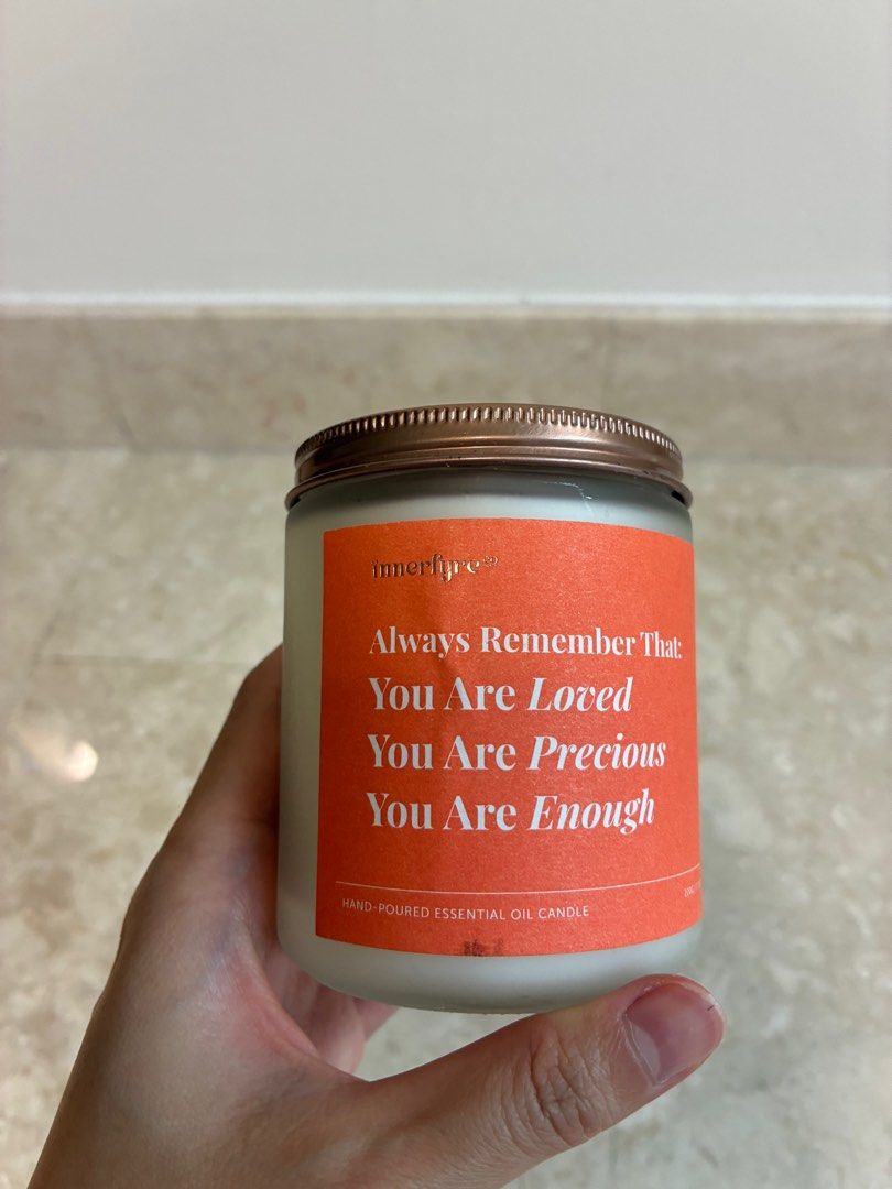 Innerfyre Co White Tea & Bergamot Candle (Category: Home Fragrance) located in Singapore. Submitted by tanya.ng (Listing ID 1439531675, Image 2). Description: - New Innerfyre Co. candle - Scent: White Tea & Bergamot - Hand-poured essential oil candle - Fresh, citrus fragrance - Best-selling scent for uplifting energy - Features a positive message.