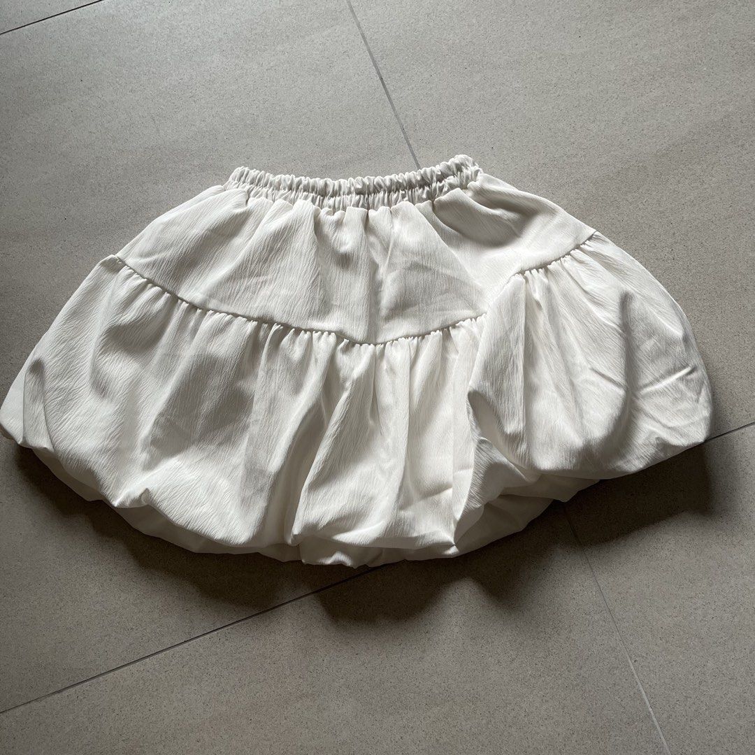 White Ribbon Bubble Skirt (Category: Skirts) located in Singapore. Submitted by skyscraper (Listing ID 1439557043, Image 3). Description: worn a few times freesized, fits XS-L from bangkok measurements: waist 9.5-16" length 12.5" details: - functional self-tie ribbon bow details at the front - elasticised waistband - no inner shorts - double lined, non-sheer - airy bubble silhouette.