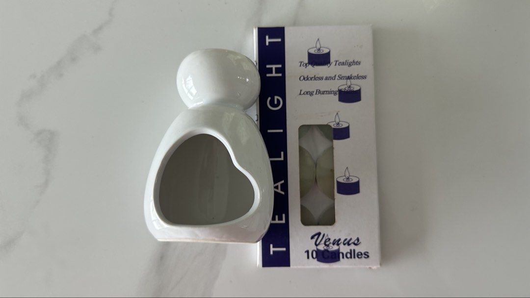 White Ceramic Cracked Fragrance Lamp Ceramic Tealight Holder with Venus 10 Tealight Candles (Category: Other Home Decor) located in Singapore. Submitted by agirl. (Listing ID 1439973915, Image 1). Description: Mail only - Charming white ceramic tealight holder - Includes 10 'Venus' brand tealight candles - Candles are odorless, smokeless, and long-burning - Perfect for home decor or as a thoughtful gift.