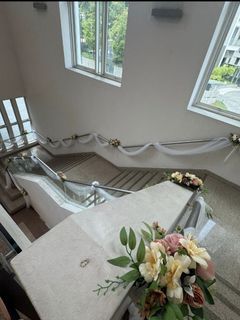 Wedding Staircase Decoration - White Drapes and Floral Accents