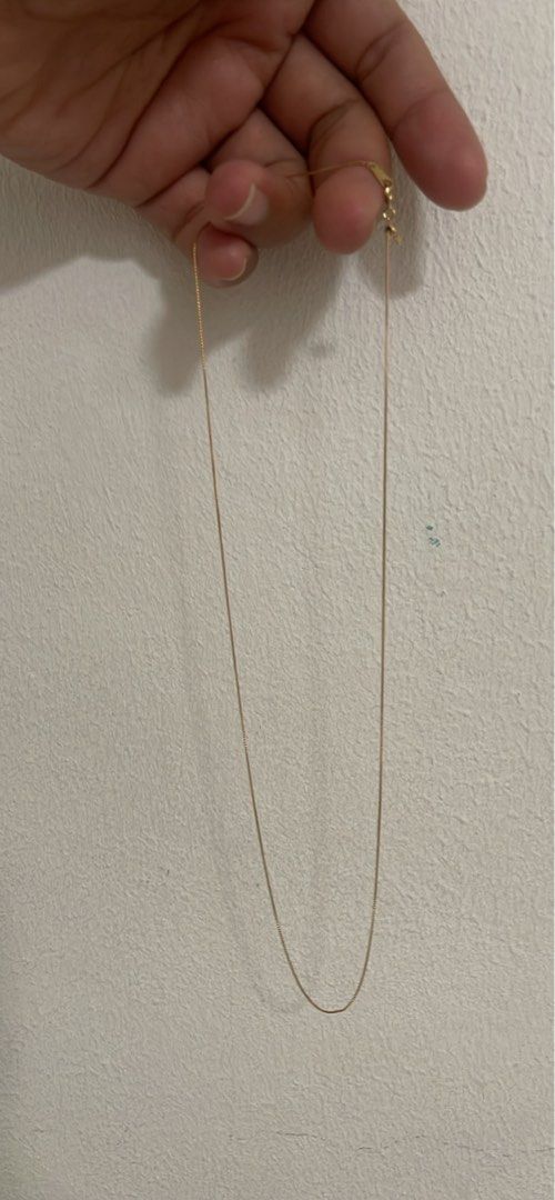 Gold Chain Necklace (Category: Necklaces) located in Singapore. Submitted by tthingsandstuffs (Listing ID 1435741095, Image 2). Description: - Delicate gold chain necklace - Simple and elegant design - Perfect for everyday wear or layering - Beautiful piece for your jewelry collection - 21cm long .