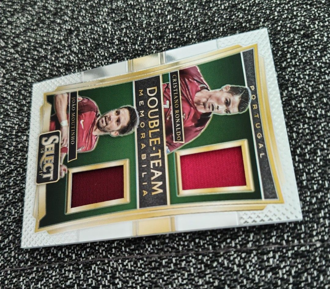 Ronaldo Portugal World Cup/Euro Panini Double-Team Memorabilia 2016/17 (Category: Vintage Collectibles) located in Singapore. Submitted by impimpi (Listing ID 1435767657, Image 6). Description: Panini Select 2016/17 card. Double-Team Memorabilia Swatch. Cristiano Ronaldo & Joao Moutinho. Red jersey player-worn materials. Self collect only at my stated location..