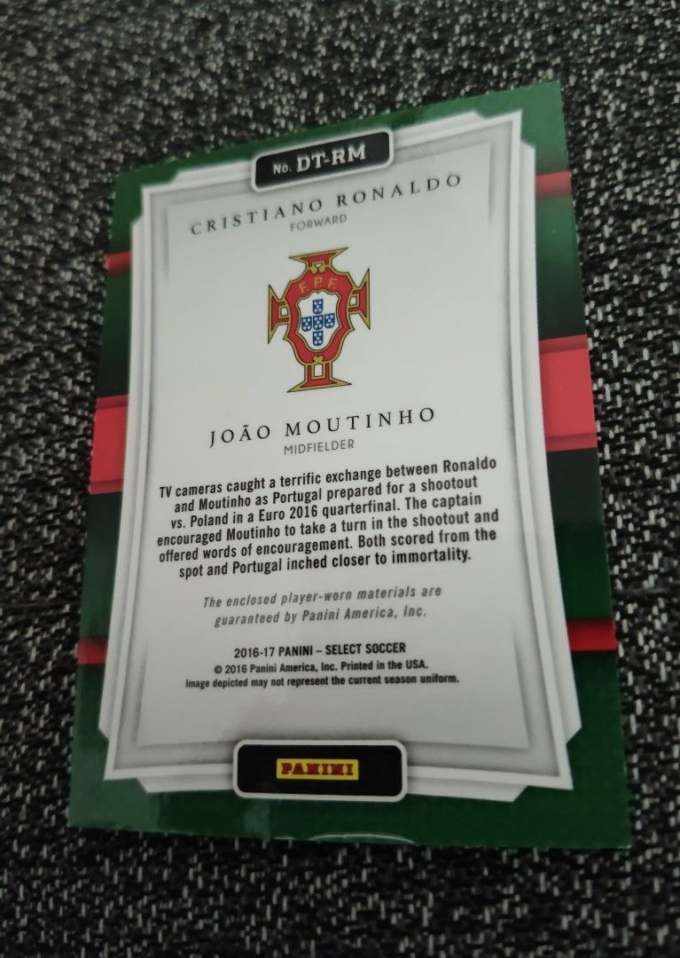 Ronaldo Portugal World Cup/Euro Panini Double-Team Memorabilia 2016/17 (Category: Vintage Collectibles) located in Singapore. Submitted by impimpi (Listing ID 1435767657, Image 4). Description: Panini Select 2016/17 card. Double-Team Memorabilia Swatch. Cristiano Ronaldo & Joao Moutinho. Red jersey player-worn materials. Self collect only at my stated location..