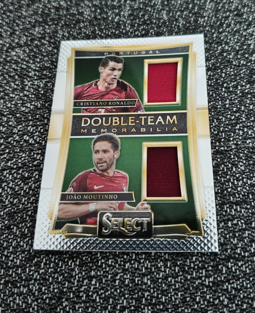Ronaldo Portugal World Cup/Euro Panini Double-Team Memorabilia 2016/17 (Category: Vintage Collectibles) located in Singapore. Submitted by impimpi (Listing ID 1435767657, Image 1). Description: Panini Select 2016/17 card. Double-Team Memorabilia Swatch. Cristiano Ronaldo & Joao Moutinho. Red jersey player-worn materials. Self collect only at my stated location..