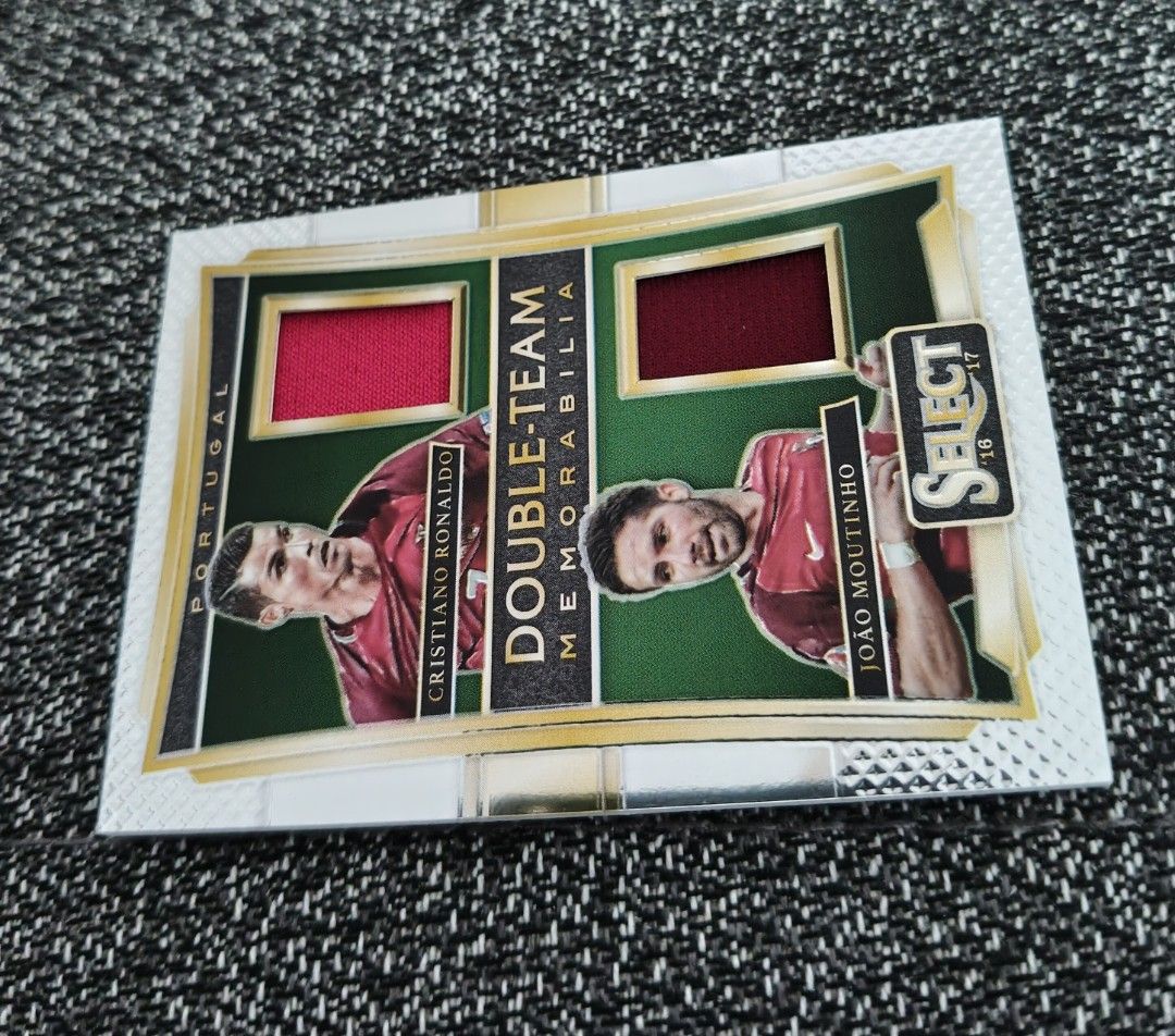 Ronaldo Portugal World Cup/Euro Panini Double-Team Memorabilia 2016/17 (Category: Vintage Collectibles) located in Singapore. Submitted by impimpi (Listing ID 1435767657, Image 5). Description: Panini Select 2016/17 card. Double-Team Memorabilia Swatch. Cristiano Ronaldo & Joao Moutinho. Red jersey player-worn materials. Self collect only at my stated location..