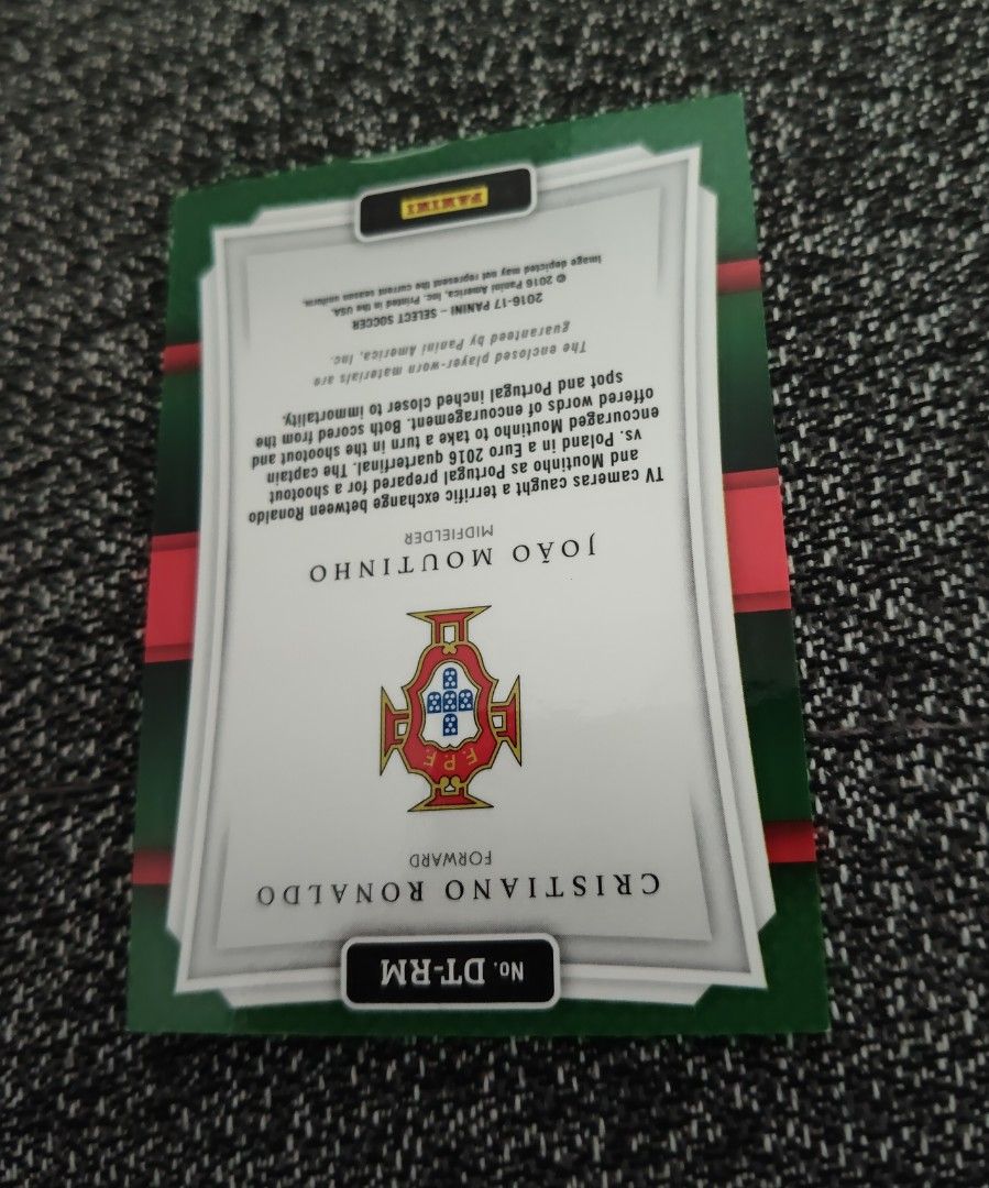 Ronaldo Portugal World Cup/Euro Panini Double-Team Memorabilia 2016/17 (Category: Vintage Collectibles) located in Singapore. Submitted by impimpi (Listing ID 1435767657, Image 3). Description: Panini Select 2016/17 card. Double-Team Memorabilia Swatch. Cristiano Ronaldo & Joao Moutinho. Red jersey player-worn materials. Self collect only at my stated location..