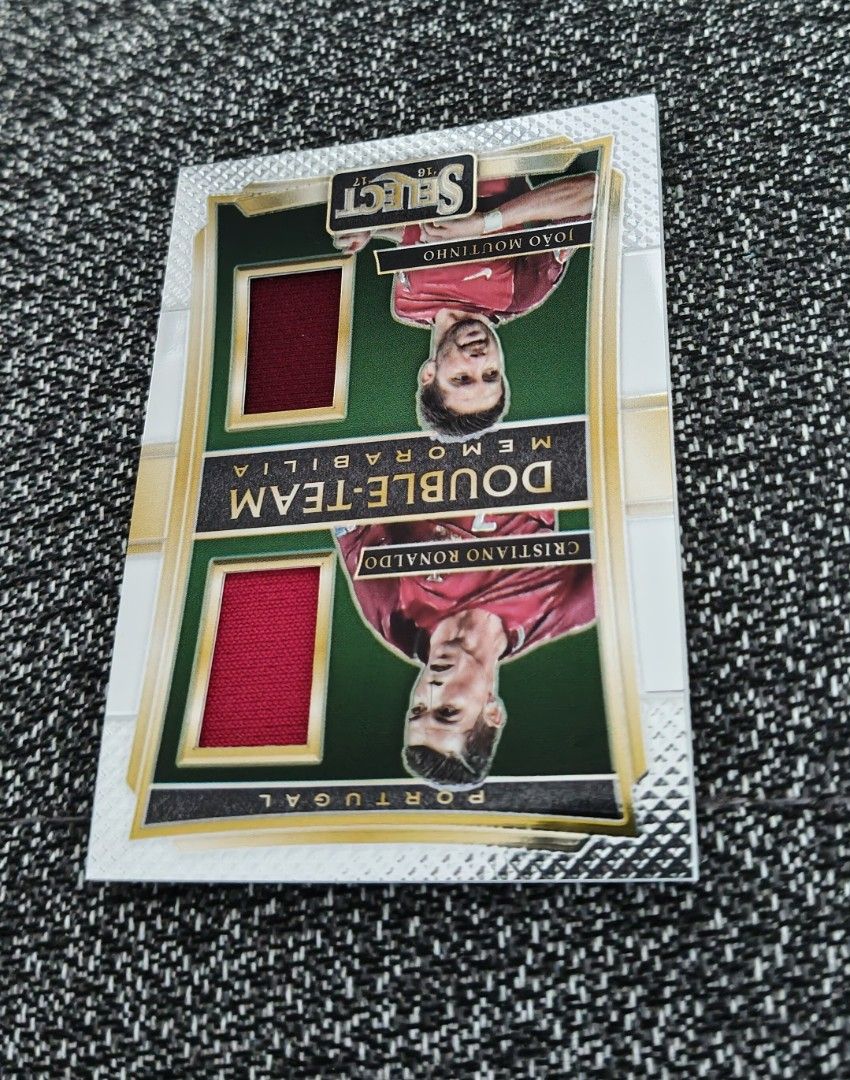 Ronaldo Portugal World Cup/Euro Panini Double-Team Memorabilia 2016/17 (Category: Vintage Collectibles) located in Singapore. Submitted by impimpi (Listing ID 1435767657, Image 2). Description: Panini Select 2016/17 card. Double-Team Memorabilia Swatch. Cristiano Ronaldo & Joao Moutinho. Red jersey player-worn materials. Self collect only at my stated location..