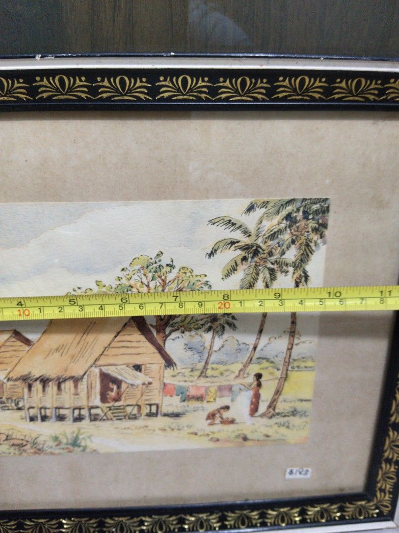 1950s Kampong Scenery Watercolour Painting of Tropical Village Scene (Category: Frames & Pictures) located in Singapore. Submitted by mypassionlisbon (Listing ID 1441154919, Image 6). Description: - Framed watercolour painting - kampong scene with stilt houses and palm trees - Figures in foreground - Artist signature: C.H. Soh - Frame: Black and gold decorative border - Dimensions: Approx. 19 inches x 15 inches.