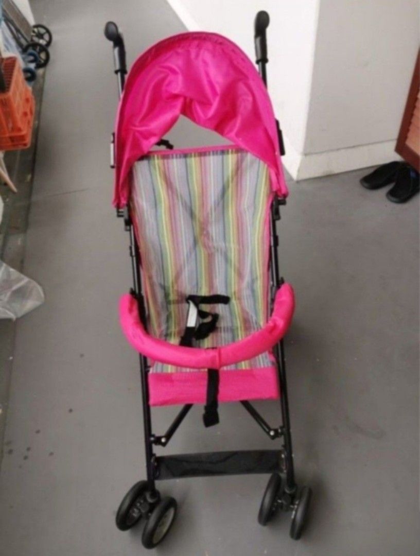 Pink Lightweight Baby Stroller (Category: Strollers) located in Singapore. Submitted by scllee (Listing ID 1443562936, Image 2). Description: - Adorable pink stroller - Comfy colorful striped seat - Folds compactly for easy storage - Built-in canopy for sun protection - Secure safety harness - Swivel wheels for effortless maneuverability - Ideal for daily walks and travel.