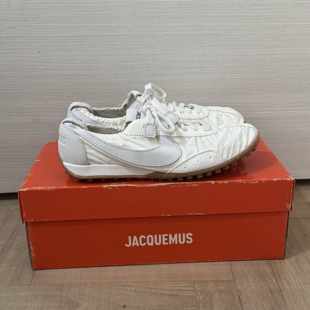 8.5W Nike x Jacquemus Moon Shoe Soft Pearl Sail (Category: Sneakers) located in Singapore. Submitted by myaesthetics (Listing ID 1443886956, Image 1). Description: - White Nike x Jacquemus collaboration sneakers - Comes with original Jacquemus box - Includes dust bag - Ideal for casual outfits.