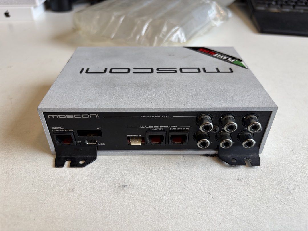 Mosconi Gladen DSP 4to6 (Category: Audio Systems) located in Singapore. Submitted by extraticks (Listing ID 1443958984, Image 1). Description: - Mosconi Gladen DSP 4to6 amplifier - Digital controller with BT and USB inputs - Analog controls for input and level adjustment - RCA output connections - Includes supply, REM, and battery ground terminals - Unit has some dust present.