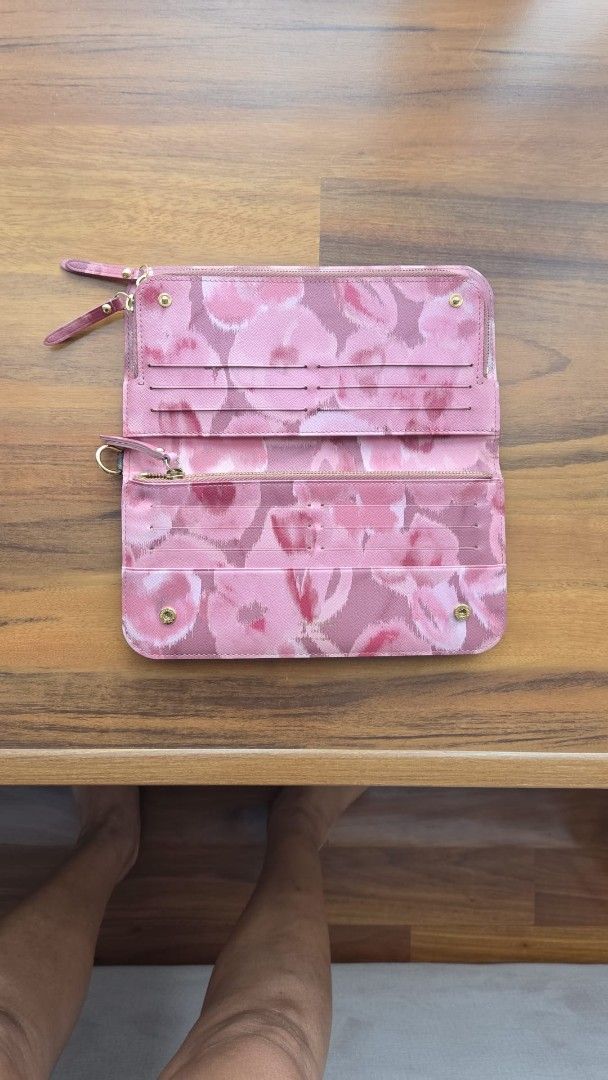 Louis Vuitton Monogram Canvas Zip Around Wallet (Category: Bags & Wallets) located in Singapore. Submitted by samnee (Listing ID 1444143704, Image 2). Description: - Authentic Louis Vuitton Monogram Wallet - Pink Floral Interior - Zip Around Closure - Multiple Card Slots & Compartments - Dimensions: Approx. 7.5 x 4 inches.