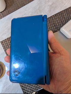 Midnight blue DSi XL console with charger working but screen has dark patch R4 card