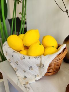 Decorative Lemons in Wicker Basket with Cloth