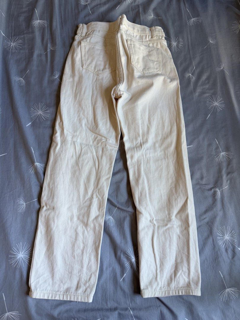 Cream High Waisted Wide Leg Jeans (Category: Jeans & Leggings) located in Singapore. Submitted by booksnotesandclothes (Listing ID 1446318071, Image 2). Description: - Cream colored jeans - High waisted with elastic waistband - Wide leg silhouette - Two front pockets - Two back pockets - Versatile for casual outfits.