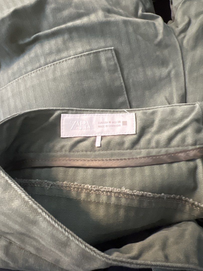 Zara Herringbone Barrel Trousers (Category: Jeans & Leggings) located in Singapore. Submitted by thrifter_sifter (Listing ID 1446261961, Image 4). Description: - Zara Green Herringbone Barrel Pants - Size: M - Subtle vertical stripe pattern - Two front pockets, two back pockets - 40cm across waist - 52cm across hip.