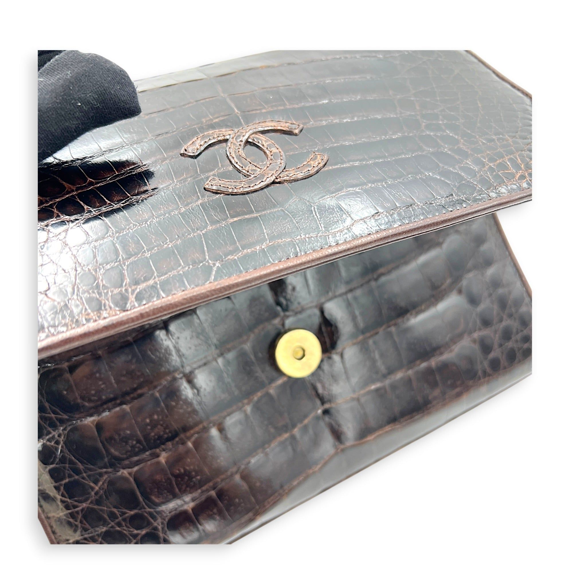 Chanel CC Vintage Flap Brown Shoulder Bag in Crocodile Leather, Gold hardware (Category: Bags & Wallets) located in Singapore. Submitted by carousellluxury (Listing ID 1435796767, Image 8). Description: SKU C2604-011437AN Material Crocodile Leather Color Brown Hardware Gold Strap Not Included Dimension (L)24cm x (H)18cm x (W)cm Accessories Authentication Card, Dust Bag, Series 1098348 Circa Est 1989-1991 Microchipped FALSE Condition - Surface: In