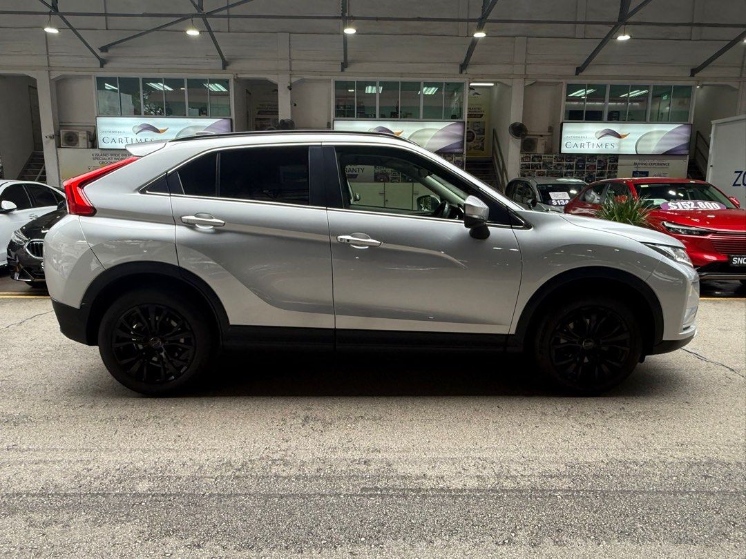 Mitsubishi Eclipse Cross 1.5T Classic (A) (Category: Used Cars) located in Singapore. Submitted by kyra-ktmotoring (Listing ID 1446567720, Image 2). Description: FULLY AGENT SERVICED UP TILL DATE ✅WEAR AND TEAR FULLY DONE UP ✅ENGINE AND GEARBOX WARRANTY COVERED TILL END OF COE ✅ 1.98% INTEREST RATE ✅HIGH LOAN APPROVAL RATE ✅ $0 DRIVEAWAY / FULL LOAN WELCOME Silver Mitsubishi Eclipse Cross. SUV with black rims. Spacious boot. Great for families or