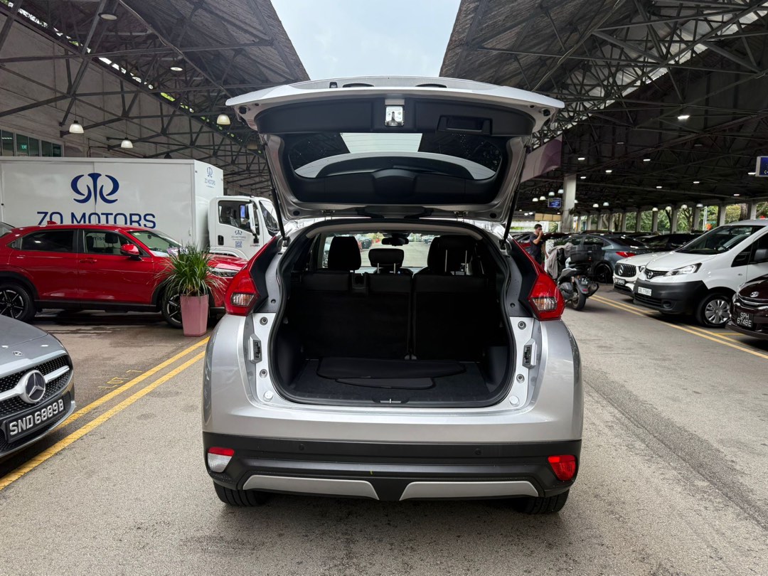 Mitsubishi Eclipse Cross 1.5T Classic (A) (Category: Used Cars) located in Singapore. Submitted by kyra-ktmotoring (Listing ID 1446567720, Image 5). Description: FULLY AGENT SERVICED UP TILL DATE ✅WEAR AND TEAR FULLY DONE UP ✅ENGINE AND GEARBOX WARRANTY COVERED TILL END OF COE ✅ 1.98% INTEREST RATE ✅HIGH LOAN APPROVAL RATE ✅ $0 DRIVEAWAY / FULL LOAN WELCOME Silver Mitsubishi Eclipse Cross. SUV with black rims. Spacious boot. Great for families or