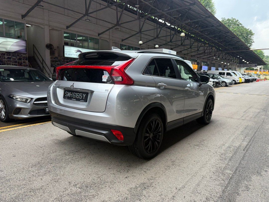 Mitsubishi Eclipse Cross 1.5T Classic (A) (Category: Used Cars) located in Singapore. Submitted by kyra-ktmotoring (Listing ID 1446567720, Image 3). Description: FULLY AGENT SERVICED UP TILL DATE ✅WEAR AND TEAR FULLY DONE UP ✅ENGINE AND GEARBOX WARRANTY COVERED TILL END OF COE ✅ 1.98% INTEREST RATE ✅HIGH LOAN APPROVAL RATE ✅ $0 DRIVEAWAY / FULL LOAN WELCOME Silver Mitsubishi Eclipse Cross. SUV with black rims. Spacious boot. Great for families or