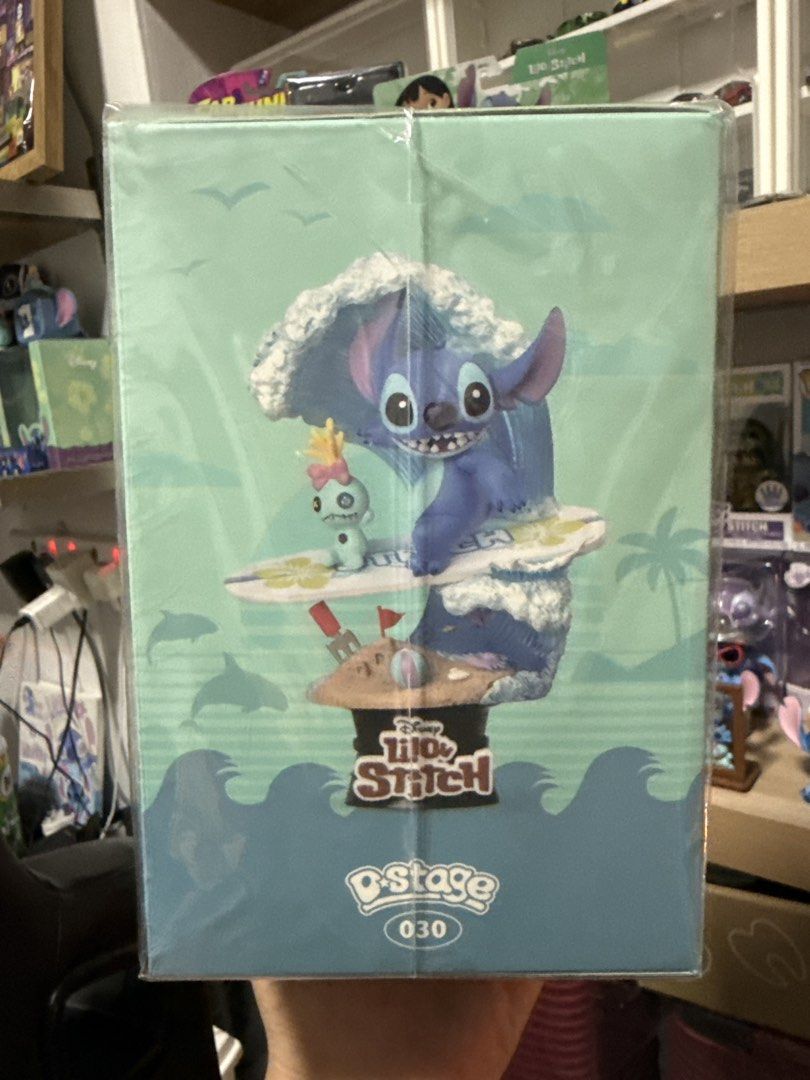 Disney Stitch Surf D-Stage 030 Beast Kingdom Figure (Category: Toy Figures) located in Singapore. Submitted by koks96 (Listing ID 1442119268, Image 4). Description: - Beast Kingdom D-Stage 030 Stitch Surf figure - Approximately 6 inches tall - Highly detailed exterior with professional paintwork - Includes official logo tag - Ideal collectible for any Stitch enthusiast.