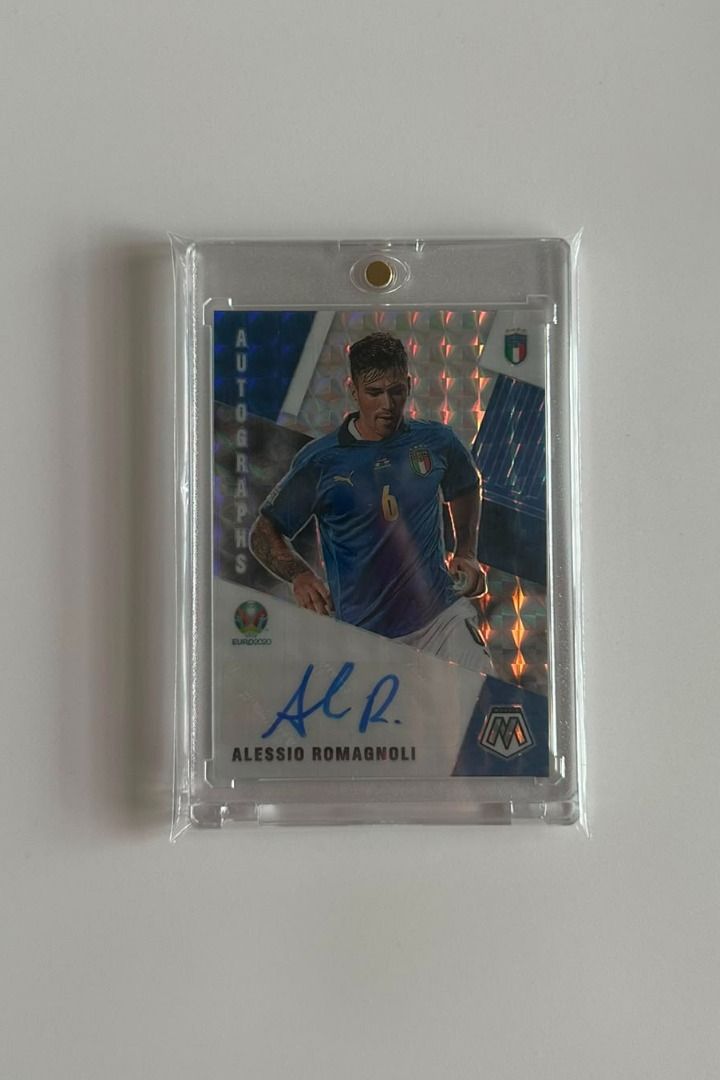 [Autograph] [Ready Stocks] [Accept Best Offer] 2021 Panini Alessio Romagnoli SILVER PRIZM AUTOGRAPHS Auto UEFA Euro #AM-ARG (Category: Raw Cards) located in Singapore. Submitted by curiocave (Listing ID 1447064459, Image 1). Description: .