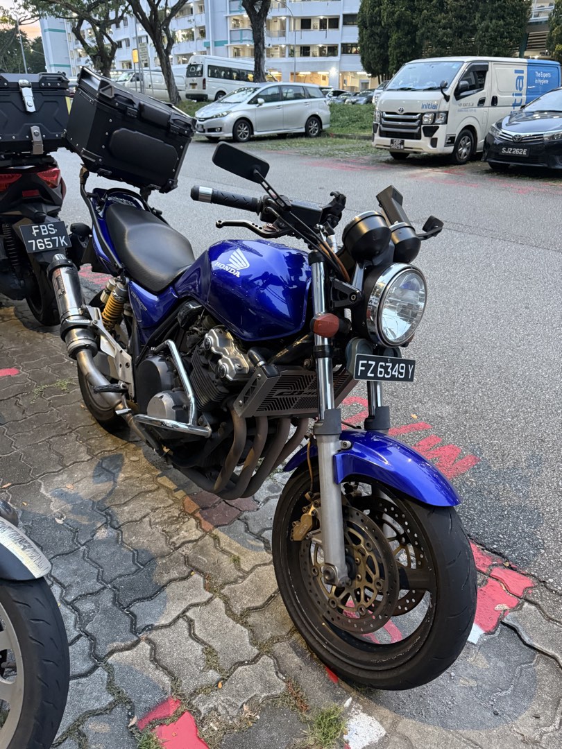 Honda CB400 Super Four Spec 3 - Yoshimura Exhaust (Category: Class 2A) located in Singapore. Submitted by tenebris04 (Listing ID 1447030974, Image 2). Description: - Honda CB400 Super Four Spec 3 - Yoshimura exhaust - Rear box included - Reg 2005 - COE Aug 2030 (NON RENEWABLE) - PM to view.