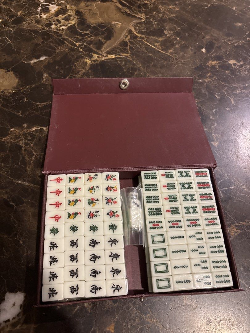 (Brand New and Sealed) Vintage mini Chinese Mahjong Set with Case (Category: Board Games & Puzzles) located in Singapore. Submitted by anna20_crystal (Listing ID 1447031703, Image 1). Description: - Complete mini Mahjong tiles -17mm x 11.5mm x2mm - Includes all tiles and dice - Deep red case with gold Chinese characters - Standard size and design tiles - Perfect for game nights.