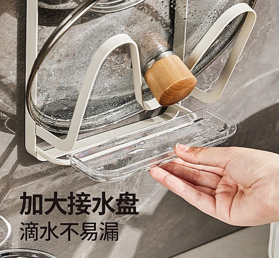 Wall Mounted Pot Lid and Cutting Board Holder (Category: Bathroom & Kitchen Fixtures) located in Singapore. Submitted by emumm (Listing ID 1447079705, Image 3). Description: - Wall-mounted kitchen organizer - Securely holds pot lids and cutting boards - Easy, damage-free installation - Comes with a drip tray to catch water - Saves valuable counter space - Efficiently organizes kitchen essentials.