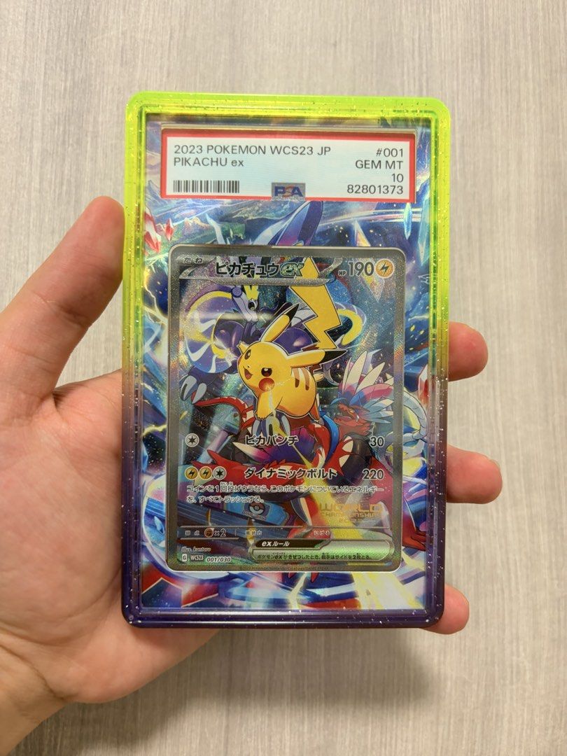 2023 Pokemon WCS23 JP Pikachu ex PSA 10 GEM MT (Category: Graded Cards) located in Singapore. Submitted by zj12345 (Listing ID 1449265766, Image 1). Description: Guard and art included - 2023 Pokemon WCS23 JP Pikachu ex Card - Graded PSA 10 GEM MT (Perfect Condition) - Rare Card #001 from the WCS23 JP Set - Features Pikachu's 'Bika Punch' and 'Dynamic Bolt' attacks - Excellent addition to any Pokemon collection.