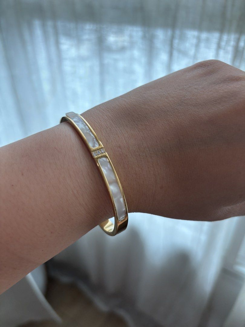 Designer Inspired Bracelets - Gold Tone (Category: Bracelets) located in Singapore. Submitted by rin_rin (Listing ID 1449163537, Image 6). Description: Selling my stash of gold bangles. Only worn for photo taking for this listing, never worn out. Kept well. - Inspired pieces, good quality - Price is fixed for 1, buy more for lower price - Chat more for details .