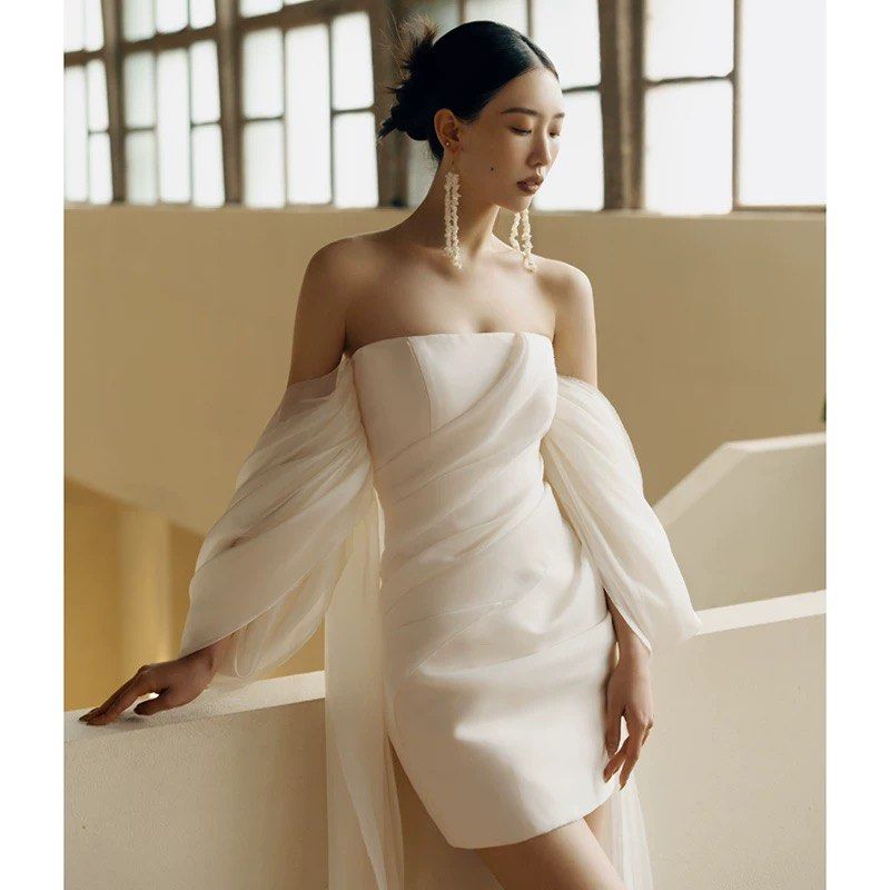 Off-Shoulder Mini Wedding Gown (Category: Evening dresses & gowns) located in Singapore. Submitted by sunevenings (Listing ID 1449268823, Image 1). Description: WORN ONCE DURING MY WEDDING PHOTOSHOOT Refer to second pic for exact measurements (Sized M on the Chart) - White off-shoulder mini gown - Sheer puff sleeves - Ruched bodice - super sturdy quality - Perfect for pre-wedding photoshoots or after party!! .
