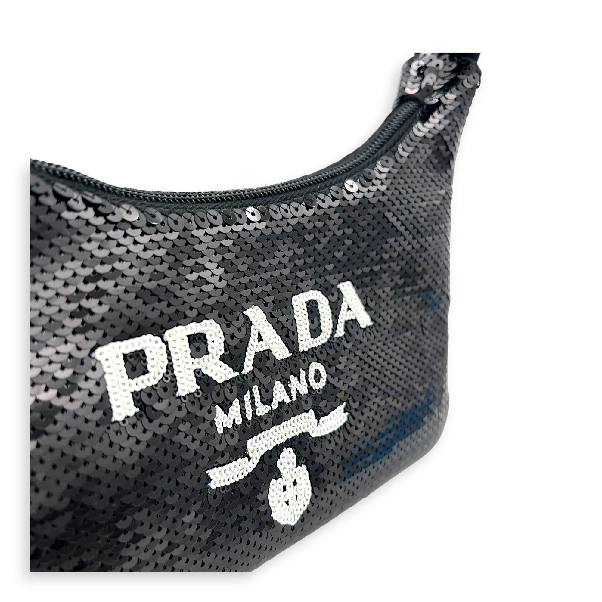 Prada Re-Edition 2000 Shoulder Bag Black in Sequins, Silver hardware (Category: Bags & Wallets) located in Singapore. Submitted by carousellluxury (Listing ID 1449628503, Image 6). Description: SKU S2605-011720AN Material Sequins Color Black Hardware Silver Strap Not Included Dimension (L)23cm x (H)14cm x (W)6cm Accessories Original Box, Series 270 Circa Est NA Microchipped FALSE Condition - Surface: very good condition overall - Surface: very go