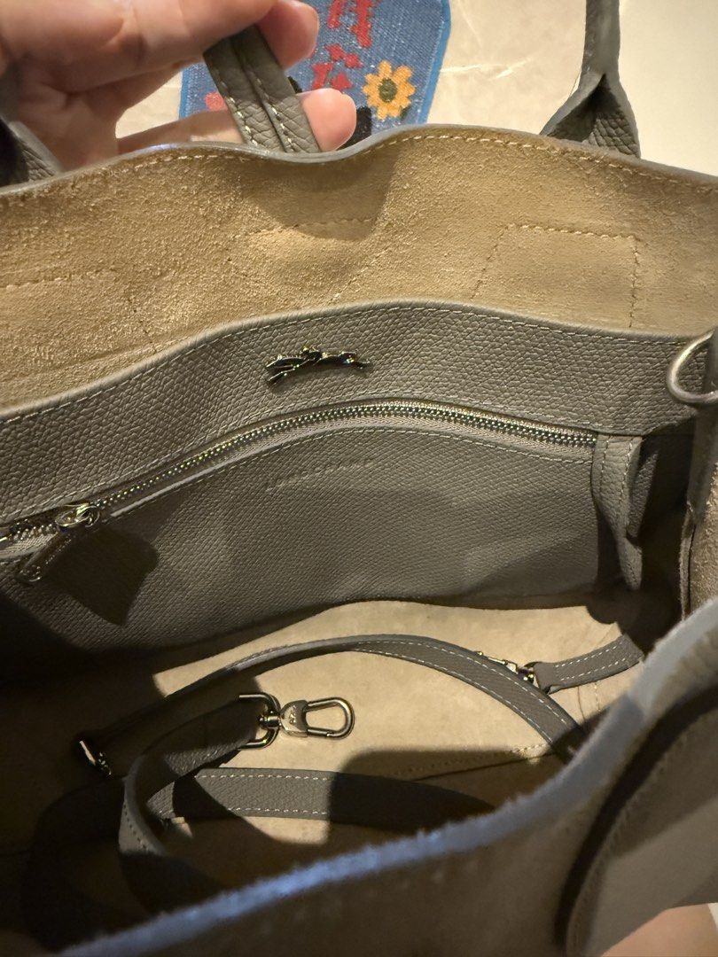 Longchamp Roseau Top Handle Bag M in Grey Leather (Category: Bags & Wallets) located in Singapore. Submitted by chikichiki96 (Listing ID 1449902233, Image 5). Description: - Brand: Longchamp - authentic 100% - Color: Grey - Dimension: 30 cm (Length) x 23.5 cm (Height) x 12 cm (Width) - Material: Leather - Features: Internal zip pocket, detachable strap - Includes: Dust bag - Ideal for: Everyday use, travel - Pick up: TPY/ Braddell mrt.