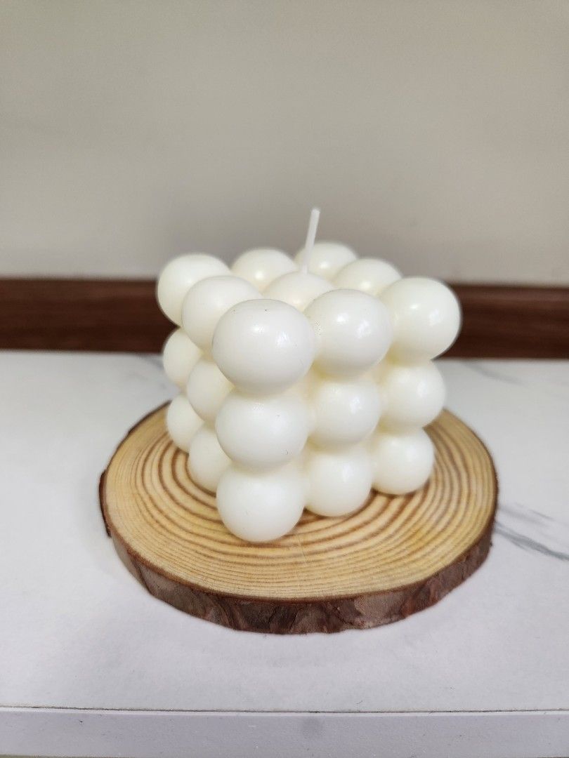 White Bubble Cube Candle (Wood not included) (Category: Home Fragrance) located in Singapore. Submitted by askangeline (Listing ID 1449838353, Image 1). Description: - Handmade white bubble cube candle (wood not included) - Unique design with many small spheres - Perfect for home decor or as a gift - Adds a modern, sculptural touch - Approx. 6cm x 6cm.