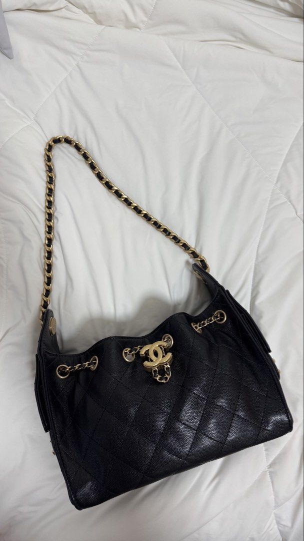 Chanel 25 Mini Hobo Bag in Black Caviar and AGHW (Category: Bags & Wallets) located in Singapore. Submitted by shopflux (Listing ID 1448419272, Image 4). Description: In Caviar and aged gold hardware (highly sought combo) Full Set - Mar 2026 Bought from Japan boutique Microchipped Used twice lightly only Condition: 10/10 like new condition Can fit a lot stuff even though it’s mini size and suits many occasions, classic piece! Comes with: Full set
