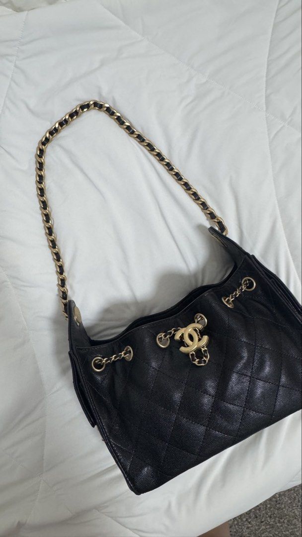 Chanel 25 Mini Hobo Bag in Black Caviar and AGHW (Category: Bags & Wallets) located in Singapore. Submitted by shopflux (Listing ID 1448419272, Image 3). Description: In Caviar and aged gold hardware (highly sought combo) Full Set - Mar 2026 Bought from Japan boutique Microchipped Used twice lightly only Condition: 10/10 like new condition Can fit a lot stuff even though it’s mini size and suits many occasions, classic piece! Comes with: Full set