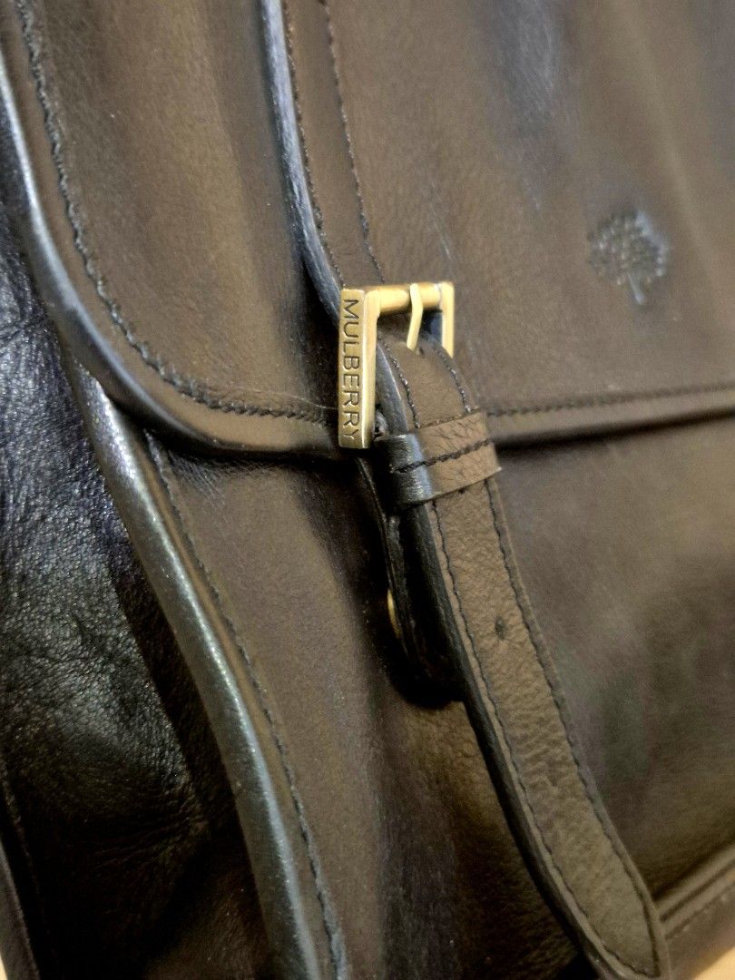 Genuine Mulberry Men's Black Leather Briefcase Messenger Bag, V Good Condition! (Not Coach) (Category: Briefcases) located in Singapore. Submitted by gleeli (Listing ID 1450189968, Image 4). Description: - RARE 2015 authentic Mulberry black leather briefcase. Leather has been oiled and stored well for last 10yrs! - Iconic Mulberry tree logo (interior & exterior), embossed on front leather (see photos) - Elegant brass hardware, with magnetic butto