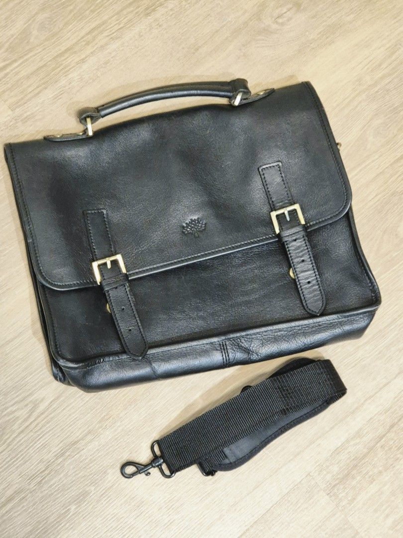 Genuine Mulberry Men's Black Leather Briefcase Messenger Bag, V Good Condition! (Not Coach) (Category: Briefcases) located in Singapore. Submitted by gleeli (Listing ID 1450189968, Image 1). Description: - RARE 2015 authentic Mulberry black leather briefcase. Leather has been oiled and stored well for last 10yrs! - Iconic Mulberry tree logo (interior & exterior), embossed on front leather (see photos) - Elegant brass hardware, with magnetic butto