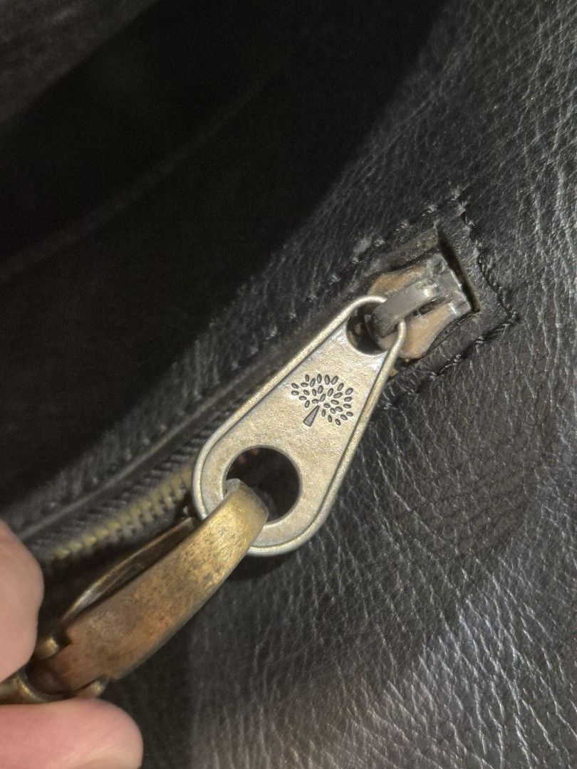Genuine Mulberry Men's Black Leather Briefcase Messenger Bag, V Good Condition! (Not Coach) (Category: Briefcases) located in Singapore. Submitted by gleeli (Listing ID 1450189968, Image 8). Description: - RARE 2015 authentic Mulberry black leather briefcase. Leather has been oiled and stored well for last 10yrs! - Iconic Mulberry tree logo (interior & exterior), embossed on front leather (see photos) - Elegant brass hardware, with magnetic butto