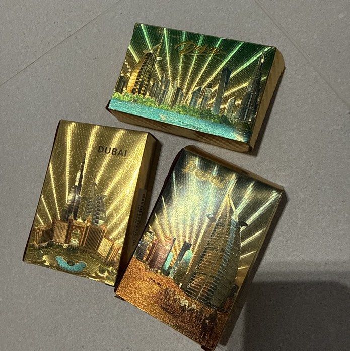 Dubai Gold Foil Souvenir Playing Cards 🃏✨ | 3 Designs | Bundle Deal (Category: Board Games & Puzzles) located in Singapore. Submitted by viangan (Listing ID 1451620633, Image 1). Description: Bring home a little piece of Dubai with these beautiful gold foil souvenir playing card decks! 🇦🇪✨ Featuring stunning Dubai landmarks and iconic skyline designs, these cards make a lovely souvenir, collector’s item and unique gift for anyone who loves Dub