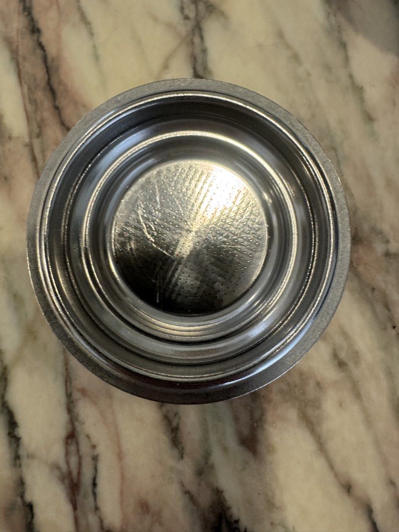 De Longhi Espresso Coffee Machine Filter Basket - Stainless Steel (Category: Bathroom & Kitchen Fixtures) located in Singapore. Submitted by croka (Listing ID 1451792537, Image 2). Description: - Stainless steel portafilter filter basket - Fits De Longhi espresso machines - Ideal for home baristas needing a replacement or spare - Note that cost is for one filter - Last two photos show the handle which these filters will fit. This is supplied with
