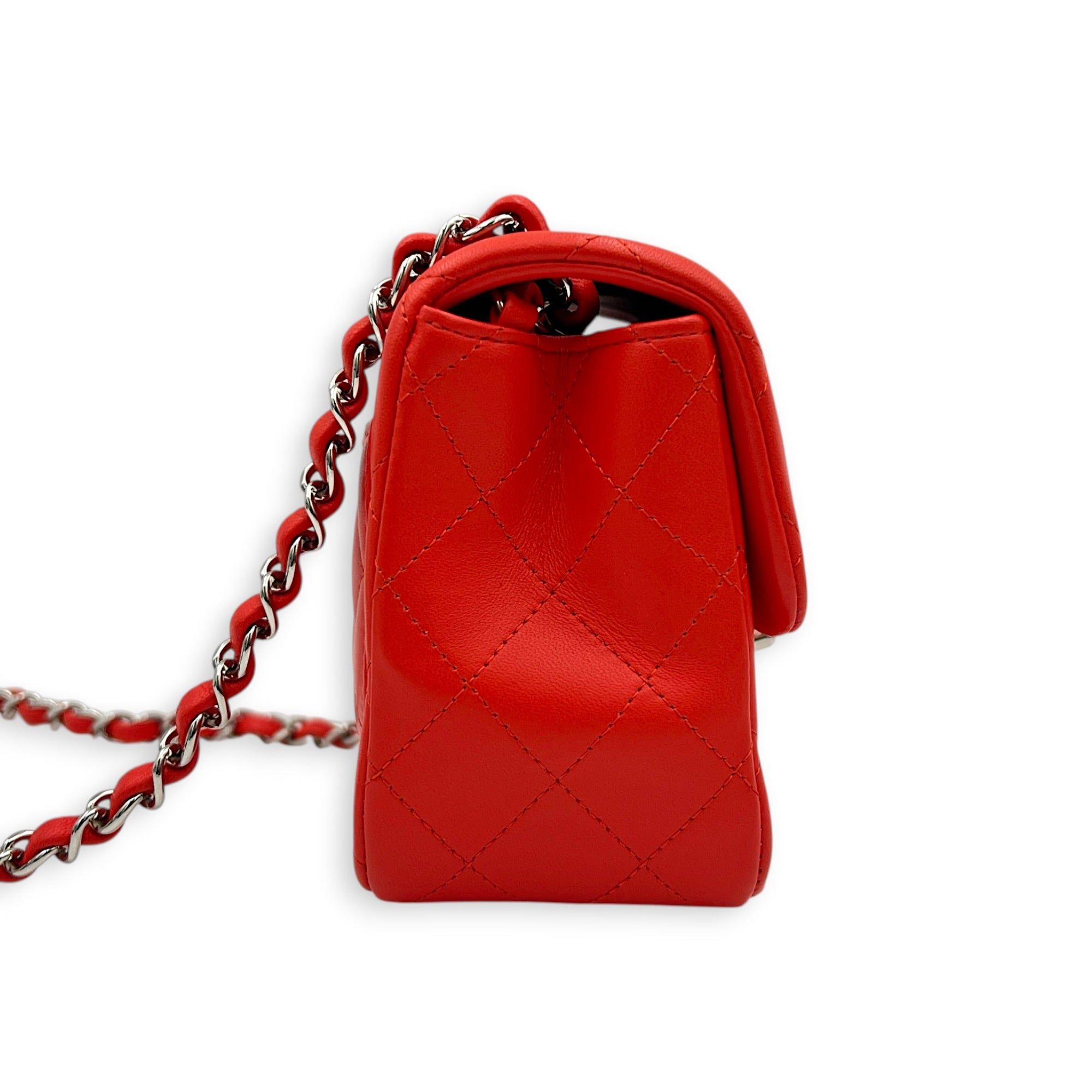 Chanel Square Mini Red Shoulder Bag in Lambskin, Silver hardware (Category: Bags & Wallets) located in Singapore. Submitted by carousellluxury (Listing ID 1452156532, Image 3). Description: SKU C2607-013632AC Material Lambskin Size Mini Color Red Hardware Silver Strap Included, non-detachable and adjustable Dimension (L)17cm x (H)13cm x (W)8cm Accessories Original Box, Dust Bag, Authentication Card, Series 27268206 Circa Est 2019 Microchipped FAL