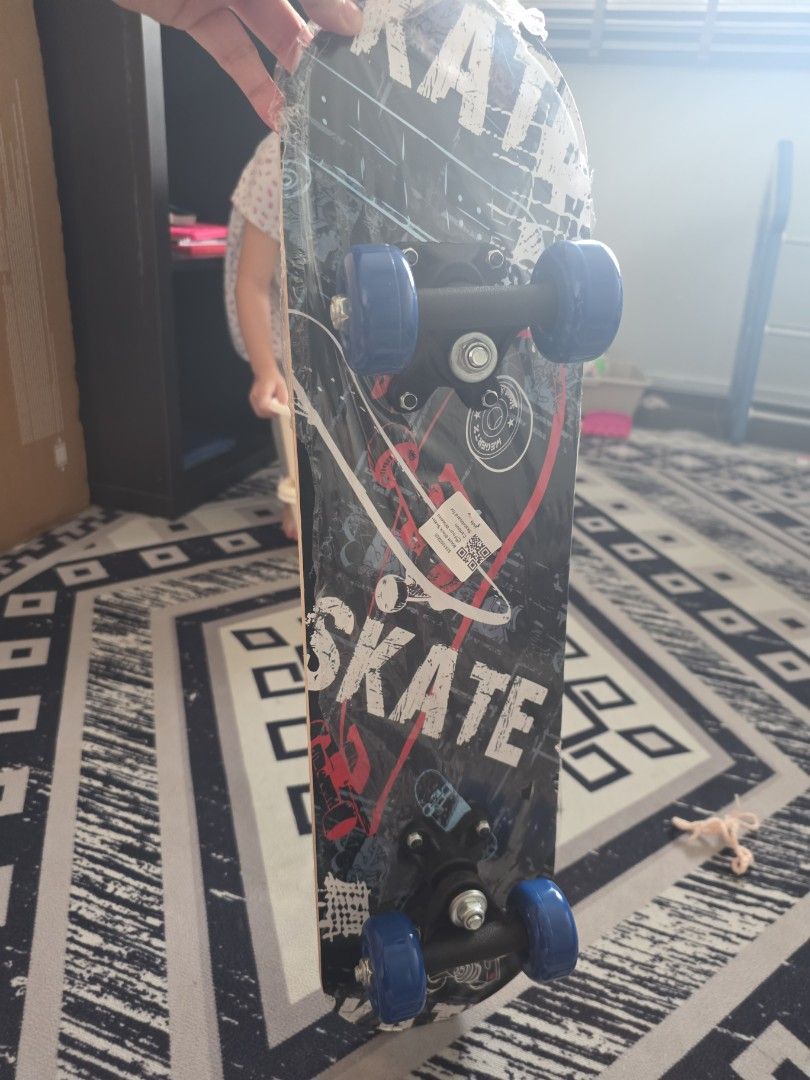 Skateboard Deck with Blue Wheels (Category: Skates, Rollerblades & Scooters) located in Singapore. Submitted by hanturaye (Listing ID 1452186265, Image 2). Description: - Eye-catching graphic design - Black deck with red & white accents - Blue wheels - Black trucks - Perfect for cruising or learning tricks - Ready for immediate skating action kids skateboard.