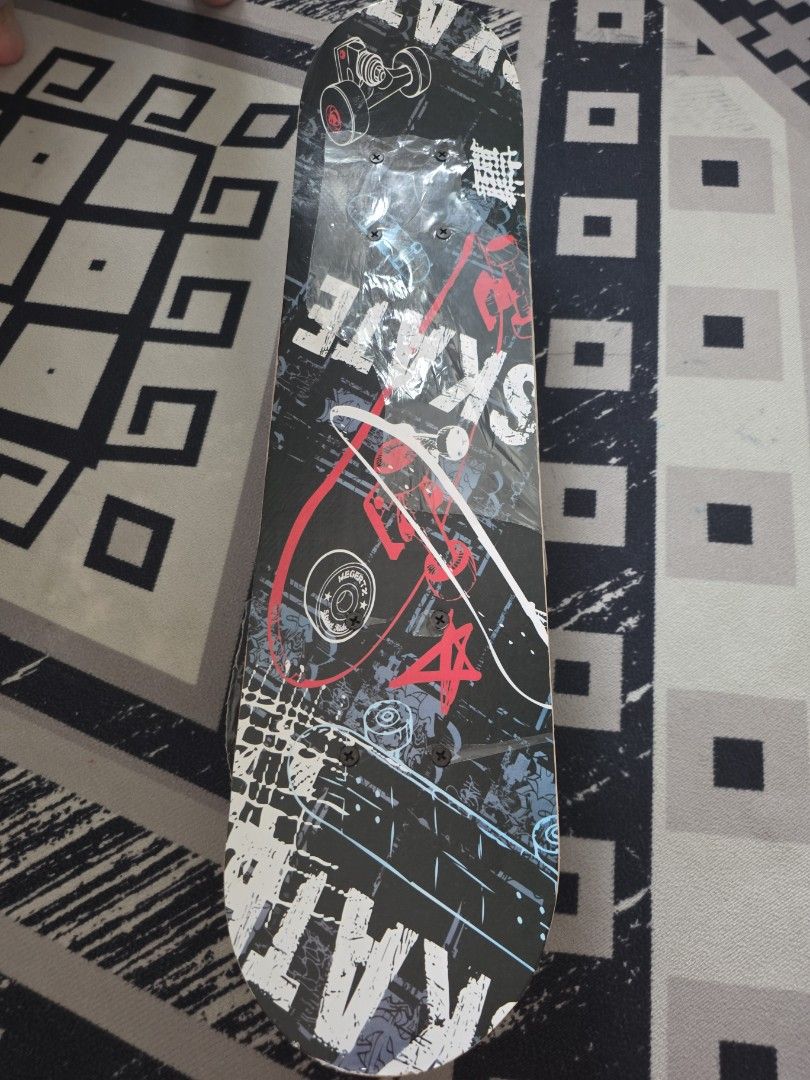 Skateboard Deck with Blue Wheels (Category: Skates, Rollerblades & Scooters) located in Singapore. Submitted by hanturaye (Listing ID 1452186265, Image 1). Description: - Eye-catching graphic design - Black deck with red & white accents - Blue wheels - Black trucks - Perfect for cruising or learning tricks - Ready for immediate skating action kids skateboard.